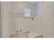 Convenient laundry room with wood-look tile flooring, shelving, and hookups for appliances at 8824 Charm Canyon Ave, Las Vegas, NV 89178