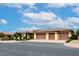 Beautiful single-story home featuring a tile roof, three-car garage, and desert landscaping at 8985 S Tomsik St, Las Vegas, NV 89113