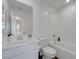 A bathroom with a white sink, cabinets, toilet and bathtub at 96 Campbelltown Ave, Henderson, NV 89015