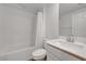 Clean bathroom with tiled shower-tub combo, modern vanity, and ample lighting for a refreshing experience at 96 Campbelltown Ave, Henderson, NV 89015