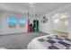 Bright bedroom with an aerial swing, stylish décor, and view to bathroom at 96 Campbelltown Ave, Henderson, NV 89015