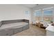 A bedroom with two desks, two windows and a daybed at 96 Campbelltown Ave, Henderson, NV 89015