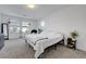 Spacious bedroom with ample natural light, neutral carpet, and a tranquil atmosphere for relaxation at 96 Campbelltown Ave, Henderson, NV 89015