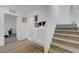 Inviting entryway with staircase, bench seating, and access to living spaces, creating a warm welcome at 96 Campbelltown Ave, Henderson, NV 89015