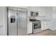 This kitchen features stainless steel appliances and white cabinets at 96 Campbelltown Ave, Henderson, NV 89015
