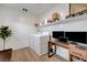 Functional laundry room with washer, dryer, storage, and workspace for added convenience at 96 Campbelltown Ave, Henderson, NV 89015