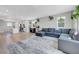 Spacious living room with modern decor and seamless flow to kitchen at 96 Campbelltown Ave, Henderson, NV 89015