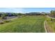 Expansive open space with lush green grass and landscaping, offering community views and a peaceful environment at 96 Campbelltown Ave, Henderson, NV 89015