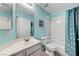 Bathroom featuring a white vanity, toilet, and shower with a blue shower curtain and blue walls at , Las Vegas, NV 89118