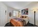 A cozy bedroom has a window, artwork, and lighting at , Las Vegas, NV 89118