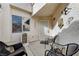 Cozy front porch with seating area, decorative wall art, and security door at , Las Vegas, NV 89118