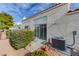 The outdoor patio is cozy, with rocks, green foliage, and an air conditioning unit at , Las Vegas, NV 89118
