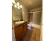 Bathroom featuring a vanity with granite countertop, toilet, and shower with sliding glass door at 100 S Crestline Dr # 18, Las Vegas, NV 89107
