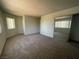 Spacious bedroom with carpet flooring and mirrored closet doors at 100 S Crestline Dr # 18, Las Vegas, NV 89107