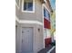 Close-up of apartment #18 with a well-maintained door, modern lock, and clean facade at 100 S Crestline Dr # 18, Las Vegas, NV 89107