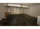 Spacious garage with a workbench and ample room for storage or vehicles at 100 S Crestline Dr # 18, Las Vegas, NV 89107