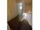 Carpeted hallway with staircase leading down and a white door to the right at 100 S Crestline Dr # 18, Las Vegas, NV 89107