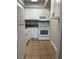 Efficient kitchen features white appliances, granite countertops, and ample cabinet storage at 100 S Crestline Dr # 18, Las Vegas, NV 89107