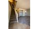 Entryway of a home with neutral-toned walls, carpeted stairs, tile entry, and a view to the living area at 100 S Crestline Dr # 18, Las Vegas, NV 89107