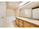 Bathroom with double sinks, a soaking tub, and granite countertops at 10001 Peace Way # 2335, Las Vegas, NV 89147