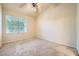 Inviting bedroom with plush carpeting, a ceiling fan, and plenty of natural light at 10001 Peace Way # 2335, Las Vegas, NV 89147