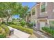 Well maintained multi-story residential building with front door entry, landscaping and sidewalks at 10001 Peace Way # 2335, Las Vegas, NV 89147