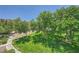 Outdoor grassy area featuring tree cover, sidewalk, and gravel patches in a community setting at 10001 Peace Way # 2335, Las Vegas, NV 89147