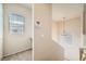 View of the hallway featuring a window, security system, and view of the stairs at 10001 Peace Way # 2335, Las Vegas, NV 89147