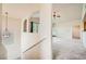 View of the hallway featuring stairs and a window looking into the living room at 10001 Peace Way # 2335, Las Vegas, NV 89147