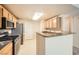 Cozy kitchen equipped with stainless steel appliances, sleek countertops, and ample cabinet space at 10001 Peace Way # 2335, Las Vegas, NV 89147