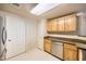 Beautiful kitchen with stainless steel dishwasher and wooden cabinets at 10001 Peace Way # 2335, Las Vegas, NV 89147
