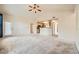 Open floorplan featuring carpet flooring and view into the kitchen at 10001 Peace Way # 2335, Las Vegas, NV 89147