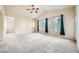 Living room featuring high ceilings, carpet floors, and lots of natural light at 10001 Peace Way # 2335, Las Vegas, NV 89147