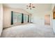 Spacious living room featuring vaulted ceiling, lots of natural light, and carpet flooring at 10001 Peace Way # 2335, Las Vegas, NV 89147