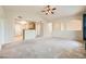 View of the living room showing the vaulted ceiling, open floorplan, and carpet flooring at 10001 Peace Way # 2335, Las Vegas, NV 89147