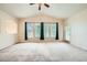 Spacious living room featuring plush carpeting, vaulted ceilings, and lots of natural light at 10001 Peace Way # 2335, Las Vegas, NV 89147