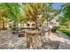 Outdoor grill and dining area with stone benches and picnic tables, perfect for community gatherings at 10001 Peace Way # 2335, Las Vegas, NV 89147