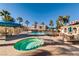 Community pool area with hot tub, shallow water area, and multiple covered seating areas at 10001 Peace Way # 2335, Las Vegas, NV 89147