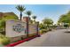 Chateau Nouveau community sign and entrance with palm trees and manicured landscaping at 10001 Peace Way # 2335, Las Vegas, NV 89147
