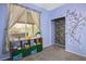 Bright bedroom featuring a large window, fun decor, and a cute alphabet light at 1027 Dawn Valley Dr, North Las Vegas, NV 89031