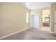 Bright bedroom with neutral carpet and access to an attached bathroom at 1027 Dawn Valley Dr, North Las Vegas, NV 89031