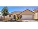 Inviting single-story home featuring a two-car garage, desert landscaping, and a welcoming entrance at 1027 Dawn Valley Dr, North Las Vegas, NV 89031
