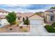 Charming single-story home with a two-car garage and well-maintained landscaping, offering great curb appeal at 1027 Dawn Valley Dr, North Las Vegas, NV 89031