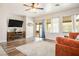 Comfortable living room with wood floors, a modern fireplace, and sliding glass doors to the outdoor patio at 1027 Dawn Valley Dr, North Las Vegas, NV 89031