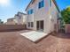 A simple backyard with a concrete patio and perimeter rock at 1030 Maple Pines Ave, North Las Vegas, NV 89081