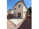 A compact backyard with low maintenance rock features a concrete patio at 1030 Maple Pines Ave, North Las Vegas, NV 89081