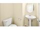 Cozy half bathroom features a pedestal sink and tile floors at 1030 Maple Pines Ave, North Las Vegas, NV 89081