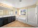 Primary bathroom features a soaking tub, double sinks and glass shower at 1030 Maple Pines Ave, North Las Vegas, NV 89081
