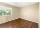 This bedroom has a window with wood-look floors at 1030 Maple Pines Ave, North Las Vegas, NV 89081
