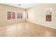 Bright bedroom featuring tile floors, a large window, and neutral paint at 1030 Maple Pines Ave, North Las Vegas, NV 89081